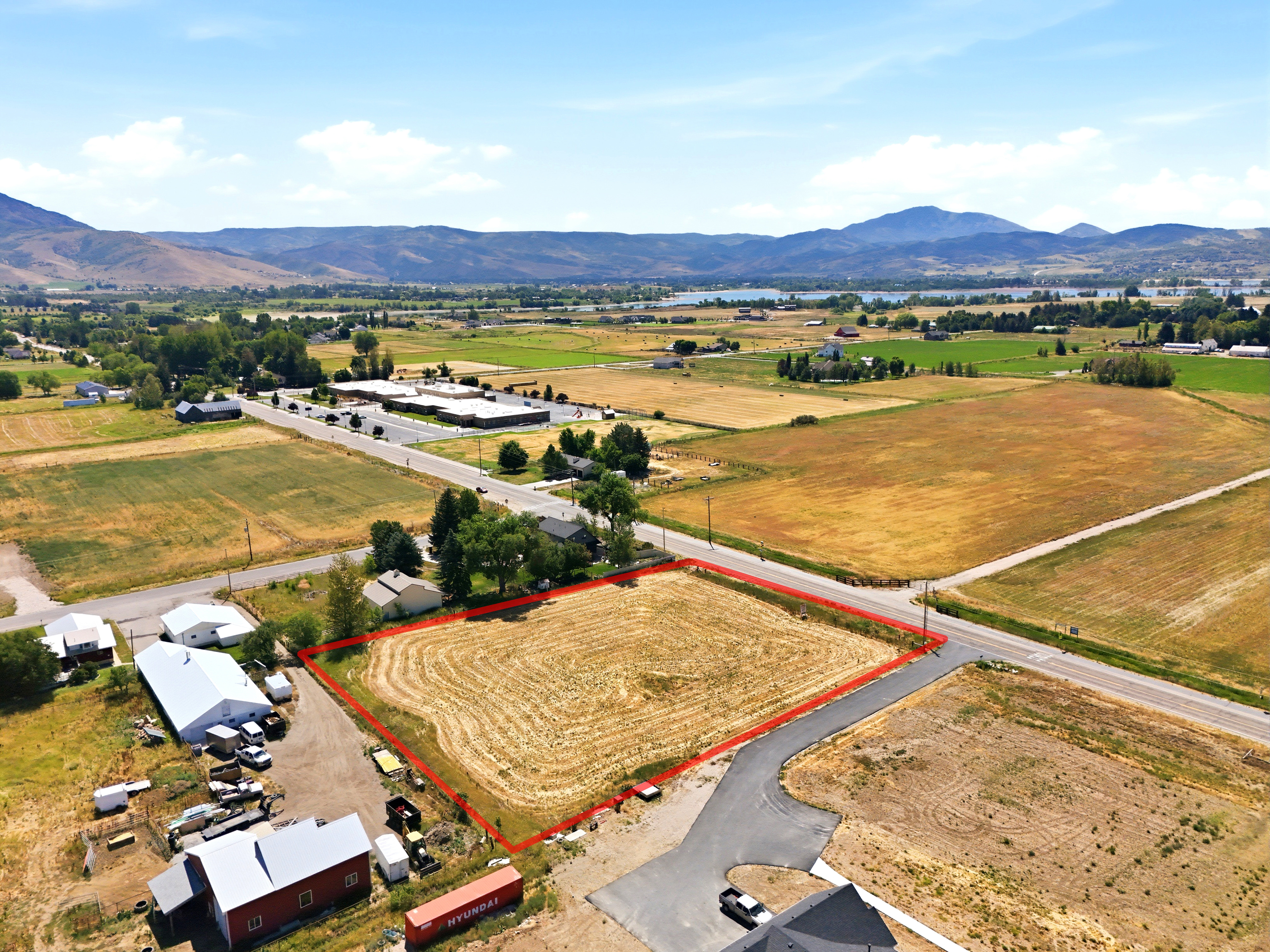 Expansive parcel featuring a cultivated field and mountainous distant scenery