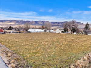 View of mountain backdrop featuring rural landscape