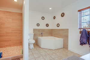 Bathroom with a garden tub, ornamental molding, tile patterned floors, recessed lighting, and a stall shower