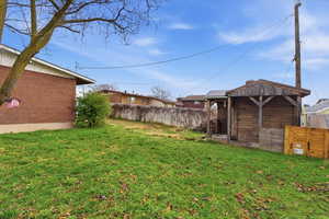 View of yard with an outdoor structure