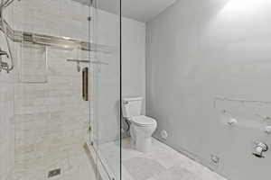 Full bath with a stall shower and a textured ceiling