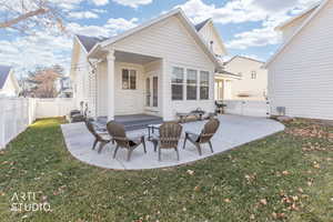 Back of house featuring a patio, a fenced backyard, and french doors