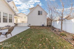 Fenced backyard with an outbuilding