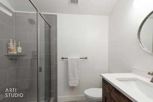 Bathroom with vanity and a stall shower