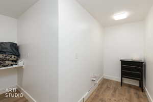 Washroom with light wood finished floors and baseboards