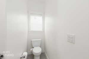 Bathroom with tile patterned flooring and toilet