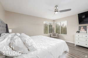 Bedroom featuring wood finished floors and a ceiling fan