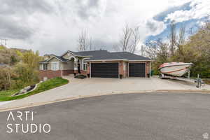 Ranch-style home with brick siding, concrete driveway, a garage, and roof with shingles