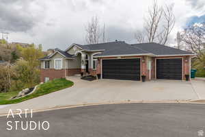 Single story home featuring an attached garage, brick siding, driveway, and roof with shingles