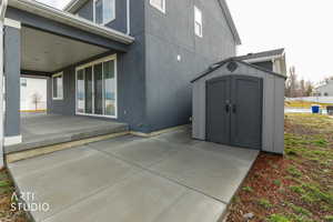 View of patio / terrace with a storage unit