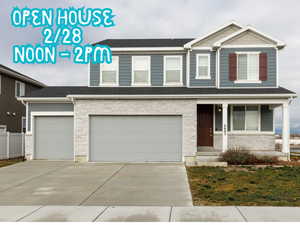 View of front facade featuring stone siding, covered porch, concrete driveway, an attached garage, and a shingled roof
