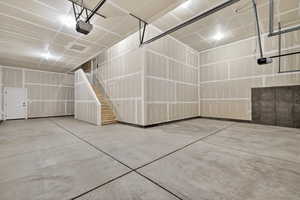 Garage featuring a garage door opener