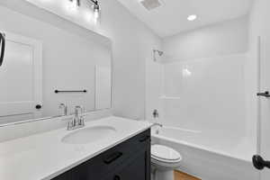 Bathroom featuring bathing tub / shower combination and vanity