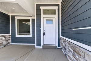 Property entrance with stone siding