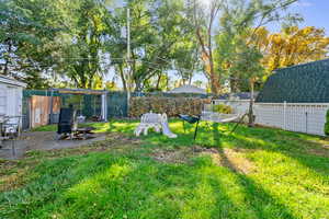 Fenced backyard with a patio area