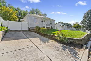 Bungalow-style home with a gate