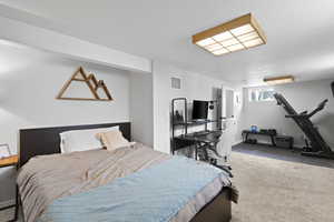 Carpeted bedroom featuring a textured ceiling