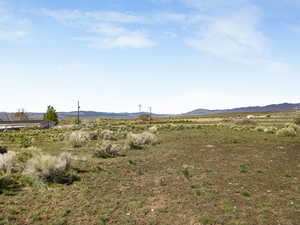 View of mountain backdrop with rural landscape