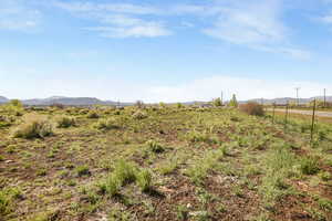 View of yard featuring a mountain view and a rural view