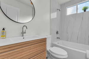 Bathroom featuring shower / bathtub combination and vanity