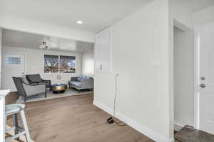 Sitting room featuring light wood-type flooring and recessed lighting