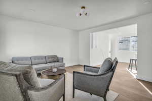 Living room featuring light wood-type flooring and recessed lighting