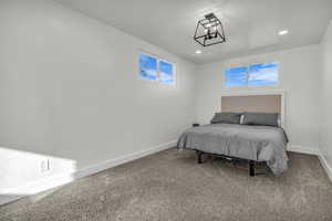 Bedroom with carpet floors and recessed lighting