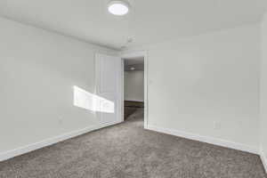 Spare room with carpet flooring and baseboards