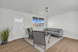 Living area featuring wood finished floors and baseboards