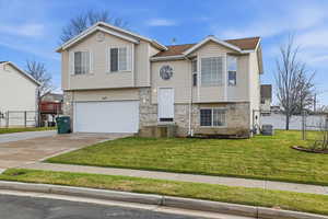 3 level split home with garage and fenced backyard