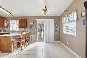 Kitchen with a kitchen bar and quarts countertops