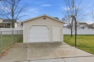 Detached garage with concrete driveway