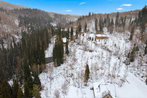 Snowy aerial view featuring a mountain view