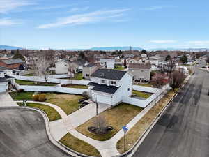 Aerial perspective of suburban area featuring a mountain backdrop
