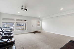 Cinema/Living Room featuring carpet flooring, plenty of natural light, recessed lighting, and a textured ceiling