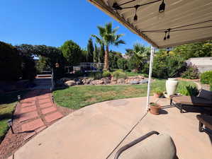 View of patio featuring a ceiling fan