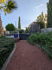 View of yard with a patio area and a jacuzzi
