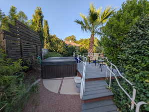 Wooden deck featuring a hot tub
