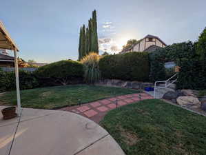 Fenced backyard featuring a patio