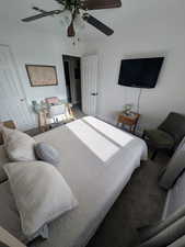 Bedroom with ceiling fan and carpet floors