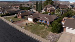 Aerial perspective of suburban area with a mountainous background