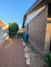 View of side of home featuring brick siding