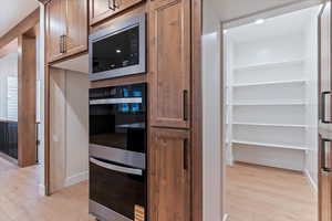 Hidden pantry door in Kitchen