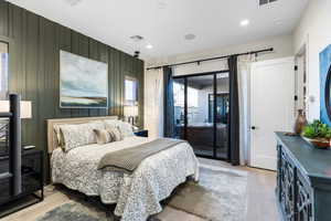 Bedroom featuring light wood-type flooring, access to outside, and recessed lighting