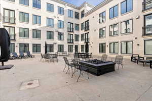 View of patio / terrace featuring an outdoor fire pit