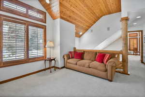 Living room featuring carpet, wood ceiling, healthy amount of natural light, vaulted ceiling, and recessed lighting