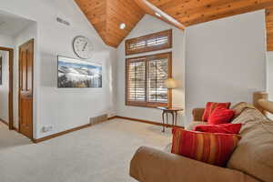 Sitting room featuring high vaulted ceiling, carpet flooring, wood ceiling, and recessed lighting