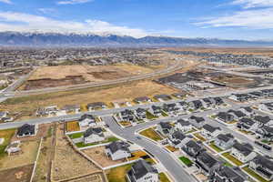 Aerial perspective of suburban area with a mountainous background