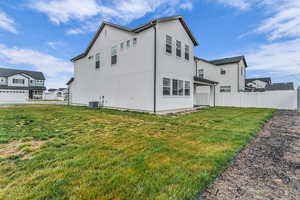 Rear view of property featuring stucco siding