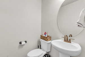 Bathroom featuring toilet and a sink